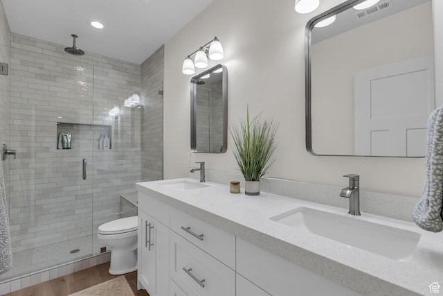 1958 E Janet Kay Ln, Holladay, UT 84121 - bathroom featuring a shower stall, wood finished floors, a sink, and visible vents