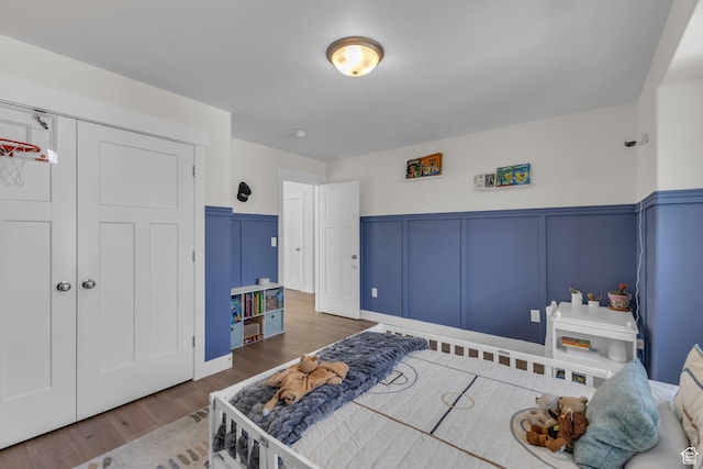 1958 E Janet Kay Ln, Holladay, UT 84121 - bedroom with a decorative wall, wood finished floors, a closet, and a wainscoted wall
