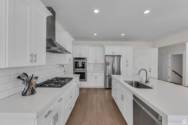 1958 E Janet Kay Ln, Holladay, UT 84121 - kitchen featuring a sink, wall chimney range hood, light countertops, and appliances with stainless steel finishes