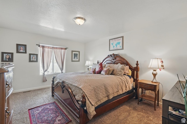 carpeted bedroom with baseboards and a textured ceiling