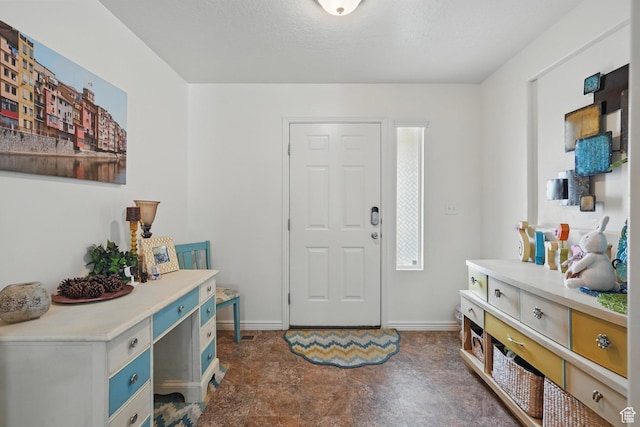 entrance foyer featuring baseboards
