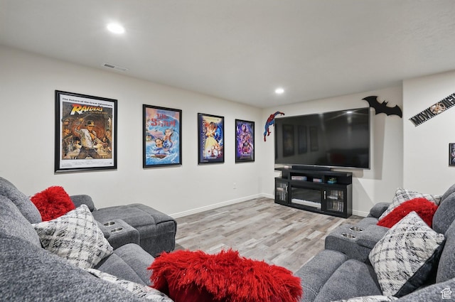 living room featuring recessed lighting, visible vents, baseboards, and wood finished floors