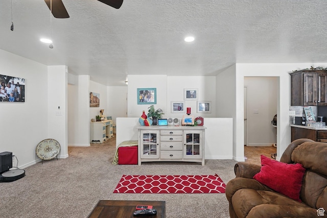 living area with ceiling fan, baseboards, carpet, and recessed lighting