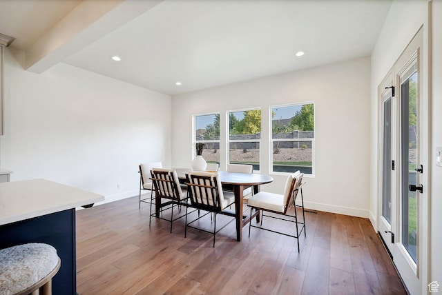 dining space featuring plenty of natural light, recessed lighting, baseboards, and hardwood / wood-style flooring