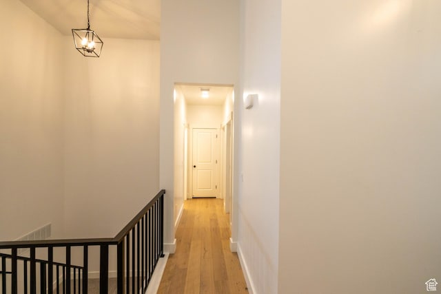 293 N Pheasant Dr, Mapleton, UT 84664 - corridor with an upstairs landing and light wood-style floors