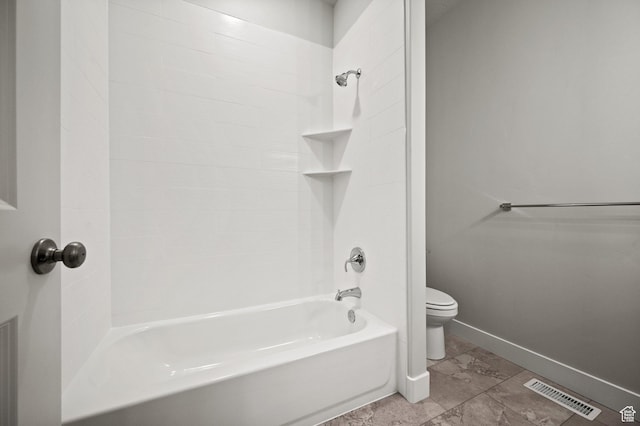 full bathroom featuring visible vents, toilet, baseboards, and washtub / shower combination
