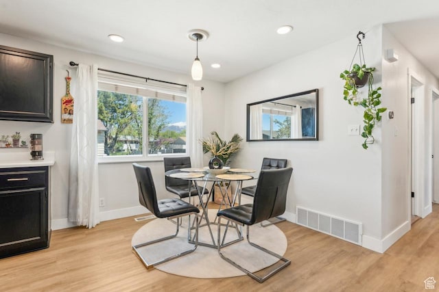 dining area with recessed lighting, visible vents, baseboards, and light wood-style flooring