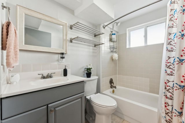 bathroom featuring toilet, vanity, and shower / bath combination with curtain