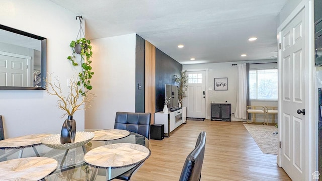 dining area featuring light wood-type flooring and recessed lighting