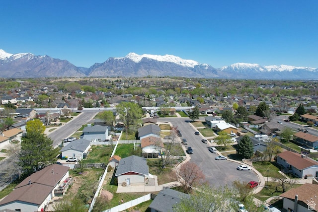 birds eye view of property with a mountain view and a residential view