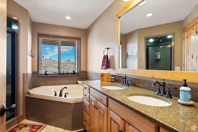 679 N Cambry Dr, Garden City, UT 84028 - bathroom with a shower stall, a garden tub, double vanity, and recessed lighting