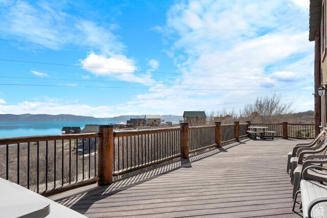 679 N Cambry Dr, Garden City, UT 84028 - wooden deck with a water and mountain view