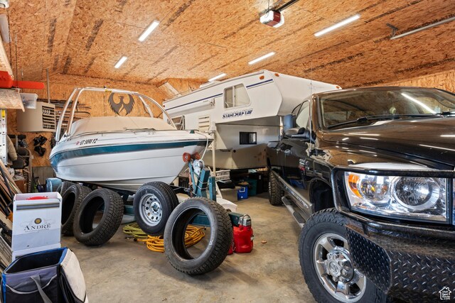 679 N Cambry Dr, Garden City, UT 84028 - garage featuring a garage door opener
