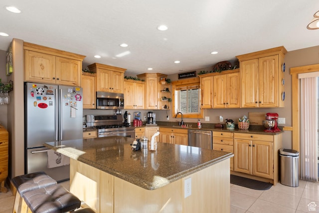 679 N Cambry Dr, Garden City, UT 84028 - kitchen with stainless steel appliances, light tile patterned flooring, recessed lighting, a sink, and a breakfast bar area