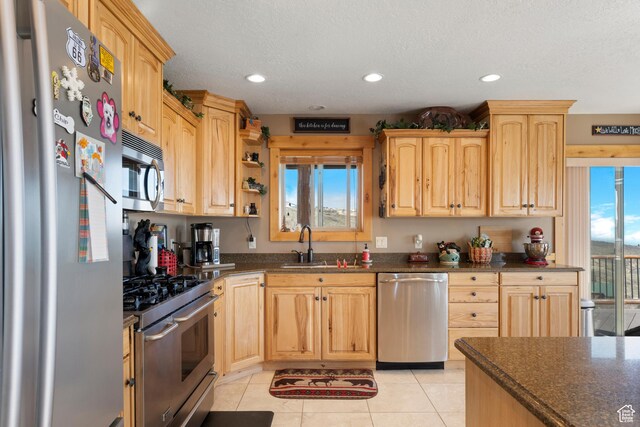 679 N Cambry Dr, Garden City, UT 84028 - kitchen featuring appliances with stainless steel finishes, light brown cabinetry, a sink, recessed lighting, and light tile patterned flooring