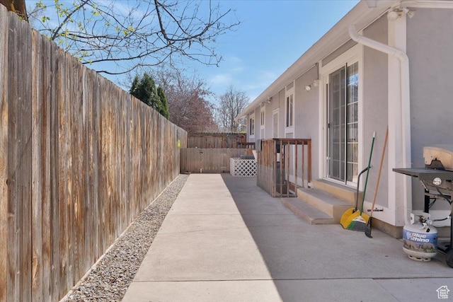 1480 N 1525 E, Logan, UT 84341 - view of property exterior with entry steps, a patio area, a fenced backyard, and stucco siding