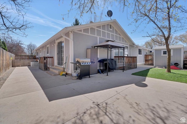 1480 N 1525 E, Logan, UT 84341 - back of house with an outbuilding, a fenced backyard, stucco siding, a patio area, and a gazebo