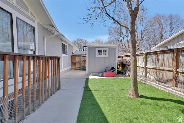 1480 N 1525 E, Logan, UT 84341 - view of yard with an outbuilding, a fenced backyard, a storage unit, and a patio area