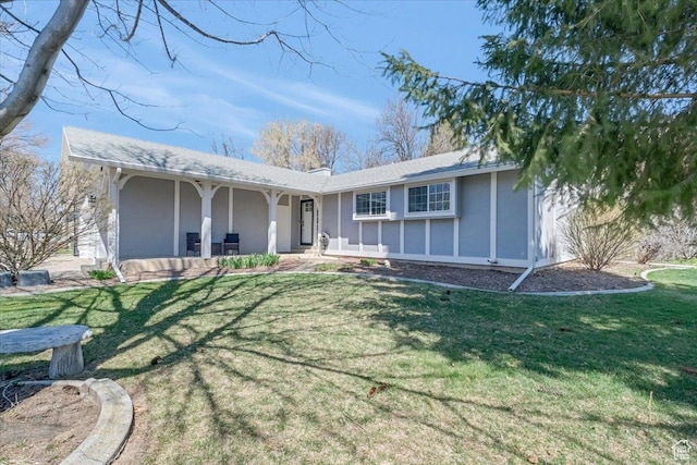 1480 N 1525 E, Logan, UT 84341 - back of house with covered porch, stucco siding, and a lawn
