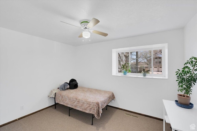 1480 N 1525 E, Logan, UT 84341 - bedroom with carpet flooring, baseboards, a ceiling fan, and visible vents