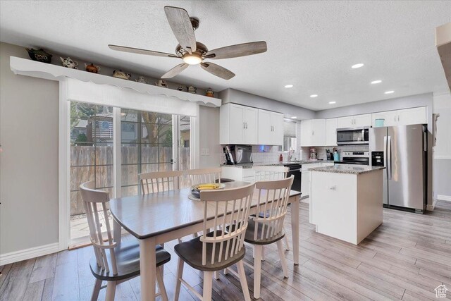 1480 N 1525 E, Logan, UT 84341 - dining space featuring ceiling fan, baseboards, and a textured ceiling