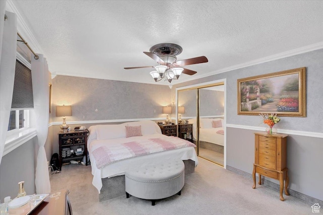 1480 N 1525 E, Logan, UT 84341 - bedroom featuring a textured ceiling, a closet, light colored carpet, and a ceiling fan