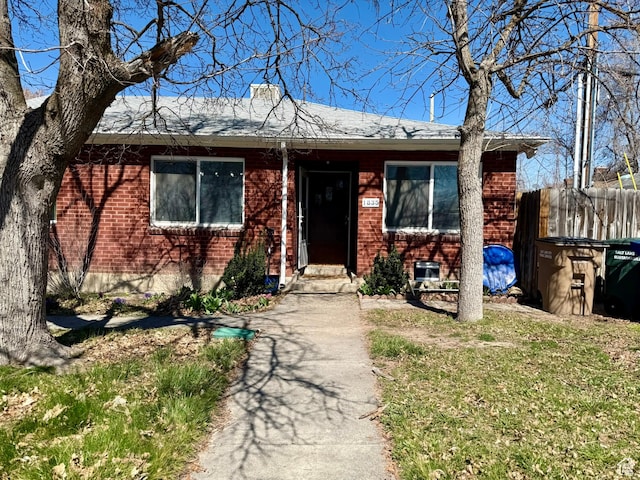view of front of house featuring brick siding