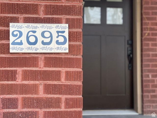 exterior details featuring brick siding