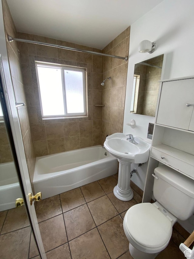 full bath featuring a sink, tile patterned flooring, shower / tub combination, and toilet