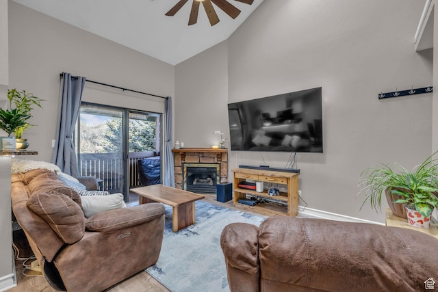 6821 N 2200 W Unit 11K, Park City, UT 84098 - living room featuring high vaulted ceiling, ceiling fan, a fireplace, wood finished floors, and baseboards