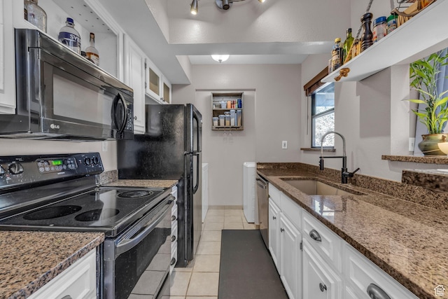 6821 N 2200 W Unit 11K, Park City, UT 84098 - kitchen featuring dark stone countertops, light tile patterned flooring, white cabinets, black appliances, and a sink