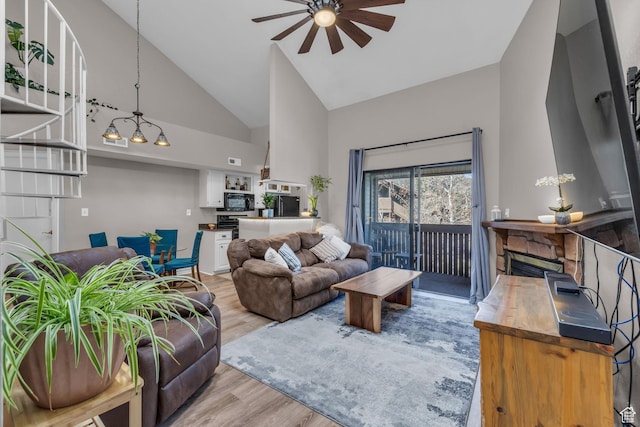 6821 N 2200 W Unit 11K, Park City, UT 84098 - living area with high vaulted ceiling, a ceiling fan, and wood finished floors