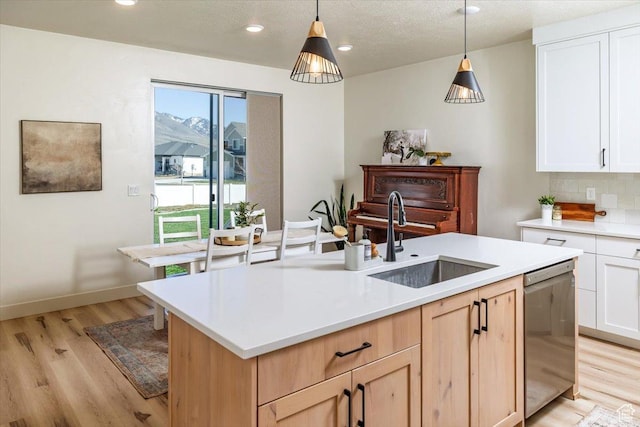 585 S 400 E, Hyrum, UT 84319 - kitchen featuring a sink, dishwasher, light wood-style floors, light countertops, and recessed lighting