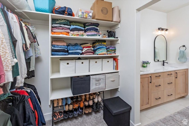 585 S 400 E, Hyrum, UT 84319 - walk in closet with light tile patterned floors and a sink