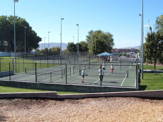 9928 S Cascade Park Dr, Sandy, UT 84070 - view of tennis court with a mountain view and fence