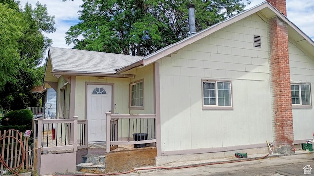 245 S 200 E, Price, UT 84501 - view of front of property with a chimney and a shingled roof