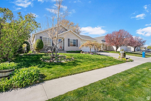 single story home with concrete driveway, a front yard, and a garage