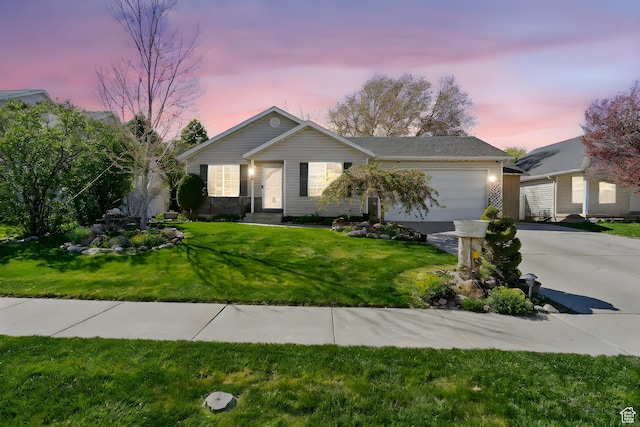 single story home featuring a garage, driveway, and a front lawn