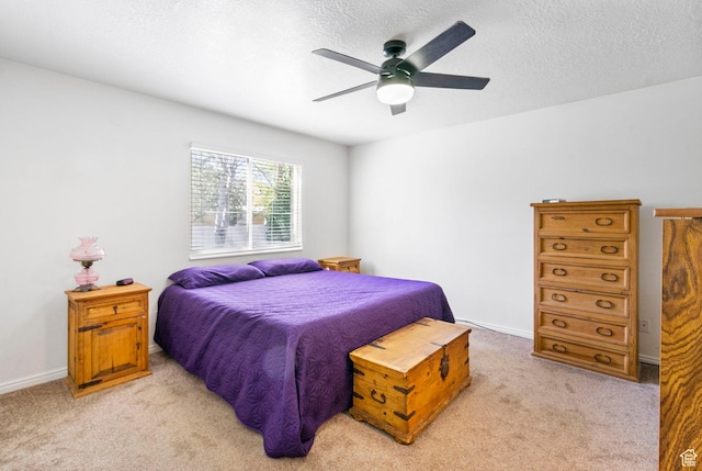 bedroom featuring ceiling fan and light colored carpet
