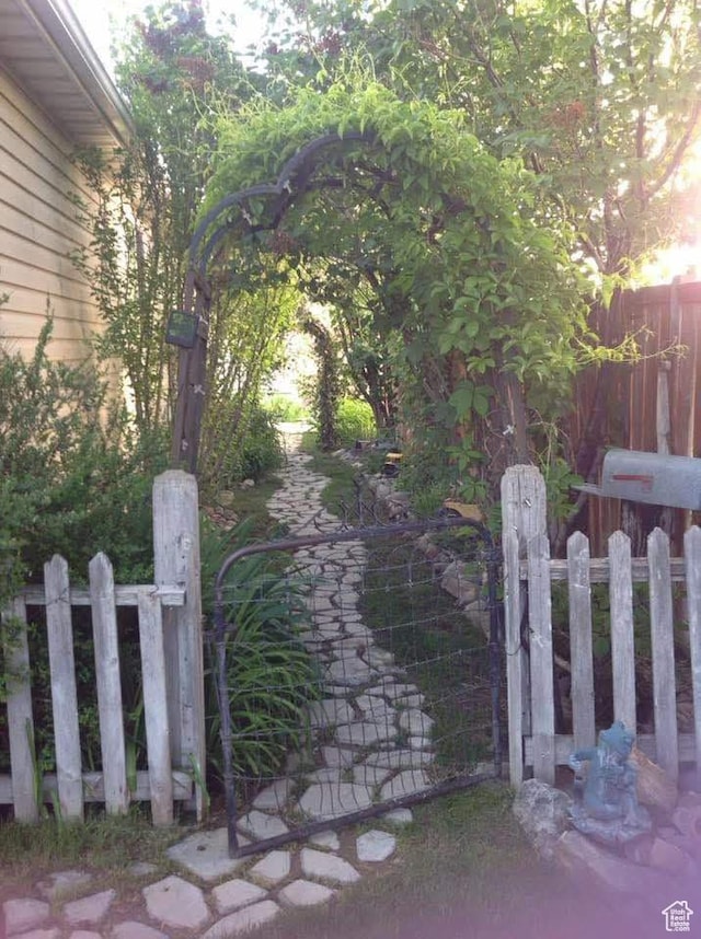 view of gate featuring fence