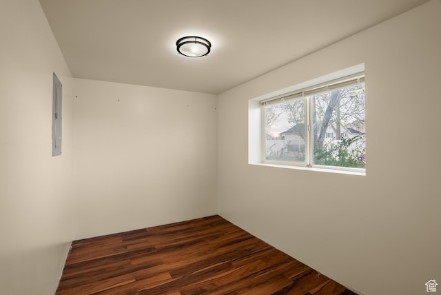 empty room with dark wood finished floors