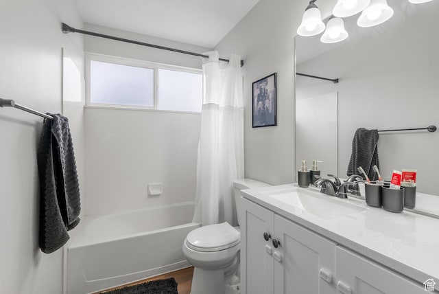 bathroom featuring toilet, shower / bath combo with shower curtain, vanity, and wood finished floors