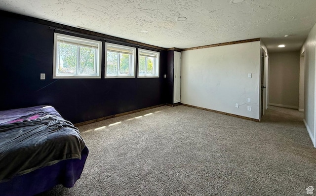 130 S 500 W, Roosevelt, UT 84066 - bedroom with a textured ceiling, carpet floors, and baseboards