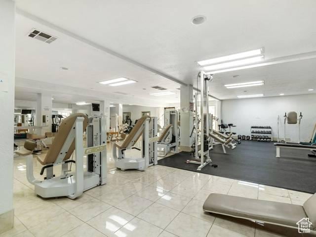 workout area featuring tile patterned flooring and visible vents
