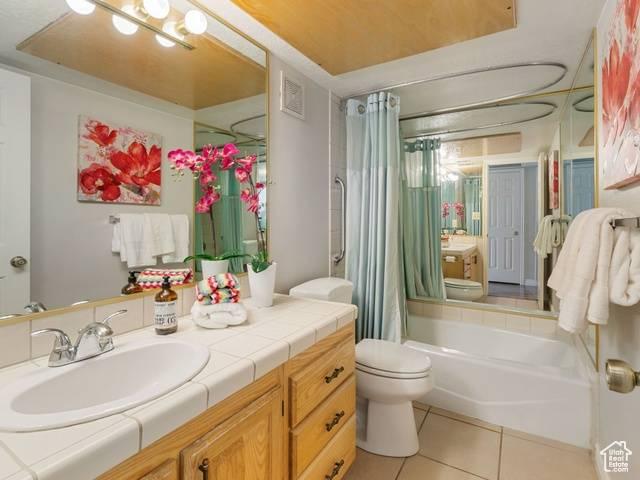 full bath with visible vents, toilet, tile patterned flooring, and vanity