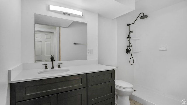 full bath with toilet, vanity, and walk in shower
