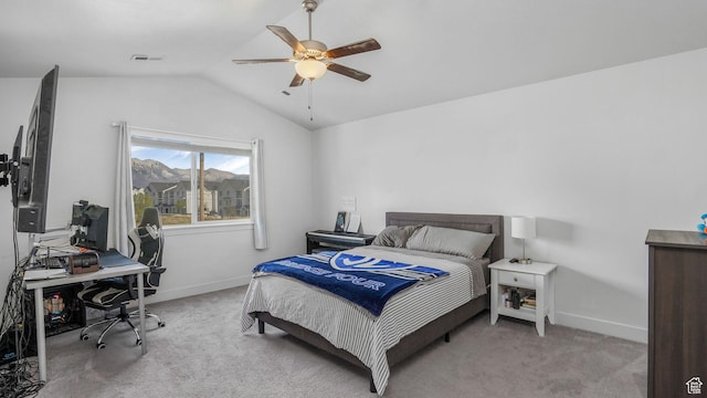 bedroom featuring visible vents, baseboards, light colored carpet, and lofted ceiling