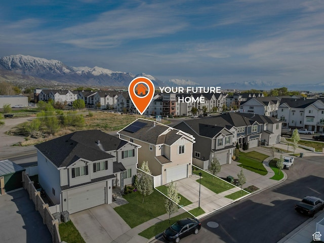 birds eye view of property featuring a mountain view and a residential view