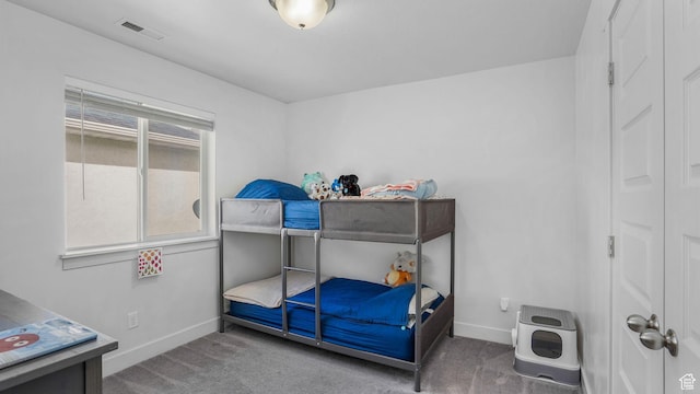 bedroom with visible vents, baseboards, and carpet floors