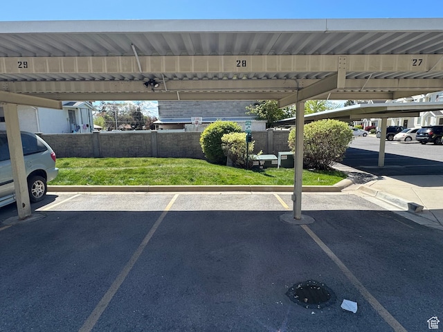 covered parking lot with fence